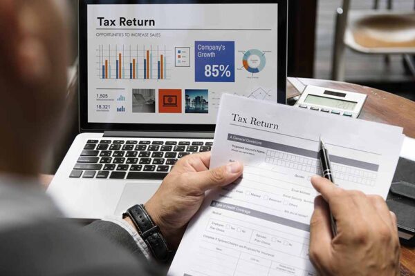 Business Man Insurance Application Form Concept Importance of Filing your Business Tax Returns